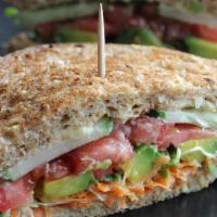 Veggie Sandwich · On a tortilla wrap: Grilled seasonal veggies, lettuce, tomato, onions, homemade pesto sauce,...