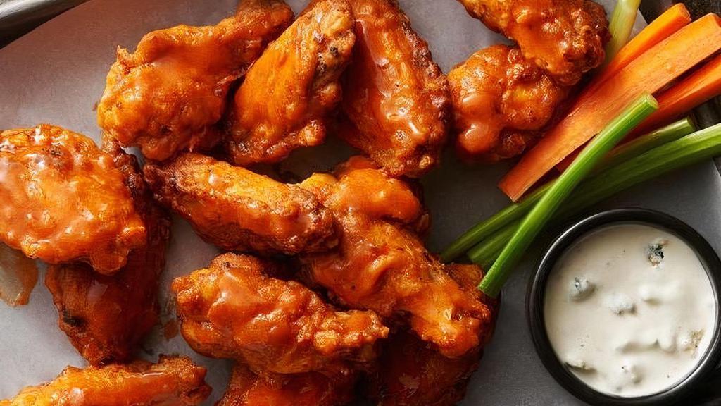 30 Wings, 2 Ultimate Crispy Fries & 4 Sodas · 30 pieces tossed in your choice of sauce, gluten-free. Choice of honey chipotle, buffalo sauce, homemade BBQ sauce, honey buffalo sauce. Choice of homemade ranch or homemade blue cheese dressings, celery, and carrots