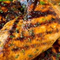 Marinated Organic Chicken Breast Side · Marinated with thyme, lemon hints, garlic and parsley.