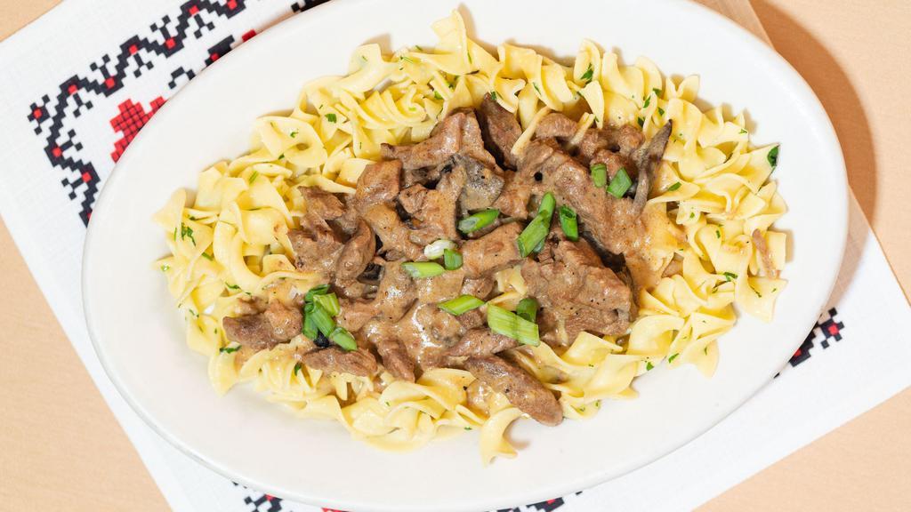 Beef Stroganoff · Tender beef strips in creamy mushroom sauce over egg noodles.