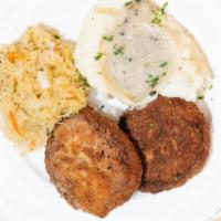 Ground Schnitzel (Kotleti) · Two breaded beef & pork patties, side mashed potato, sauerkraut.