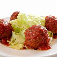 Meatball Salad · Chef Gennaro’s famous meatballs topped with “Sunday Gravy” served around a bed of iceberg le...