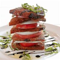 Eggplant Tower · Crispy eggplant layered with fresh tomato and fresh mozzarella finished with a drizzle balsa...