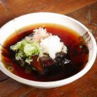 Agedashi Nasu · Deep fried Japanese eggplant served in tempura sauce with garnishes.