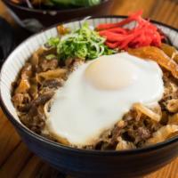Gyu Don Bowl · Braised sliced beef and onion with egg and served on white rice.