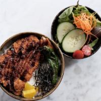 Katsu Don Bowl · Fried pork cutlet and sliced onion coated with egg and served on white rice.
