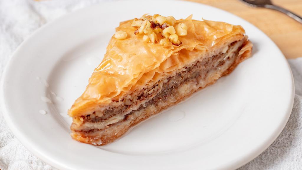 Baklava · Layers of phyllo filled with chopped nuts, sweetened &held together with syrup.