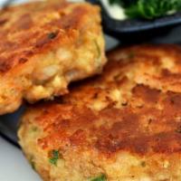 Crab Cakes  · 2 pcs delicious crab meat mixed with fresh herbs and spices.