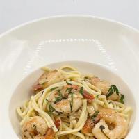 Shrimp Scampi · tender jumbo tail-on shrimps, on a bed of linguine in a white wine sauce with fresh Parmesan...