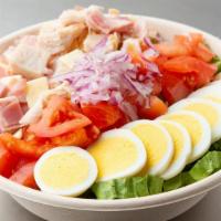 Chef Salad · Romaine, tomatoes, carrots, boiled egg, turkey breast, turkey ham, Swiss and American cheese.