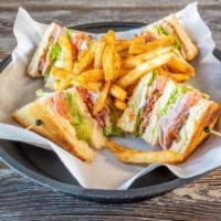 Turkey Club Sandwich · Turkey with cheese, lettuce, tomato and pickles.