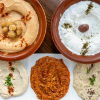 Baba Ghanouj Dip · Roasted eggplant and tahini puree, with a hint of garlic, topped with olive oil.
