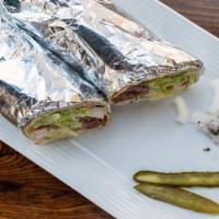 Kafta Kebab Sandwich · A combination of fresh ground lamb and beef kebab, wrapped with lettuce, tomato, onion, pick...
