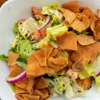 Fattoush · A romaine heart based salad, infused with a tangy Lebanese sumac lemon vinaigrette and spice...