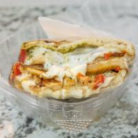 Italiano · Grilled chicken, roasted peppers, pesto sauce, fresh mozzarella.