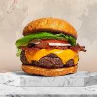 Pumped Up Peppa Burger  · American burger patty topped with melted cheese, layers of crispy vegan bacon, lettuce, toma...