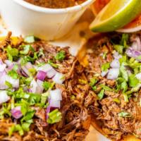 Vampiro Plate · Two open faced tacos topped with cheese, birria meat, cilantro, red onions, house salsa, and...