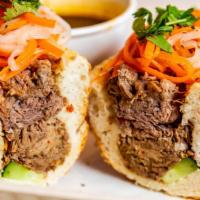 Birria Banh Mi · Vietnamese inspired sandwich with barrio meat, mayo, cucumber, pickled carrots and daikon (r...