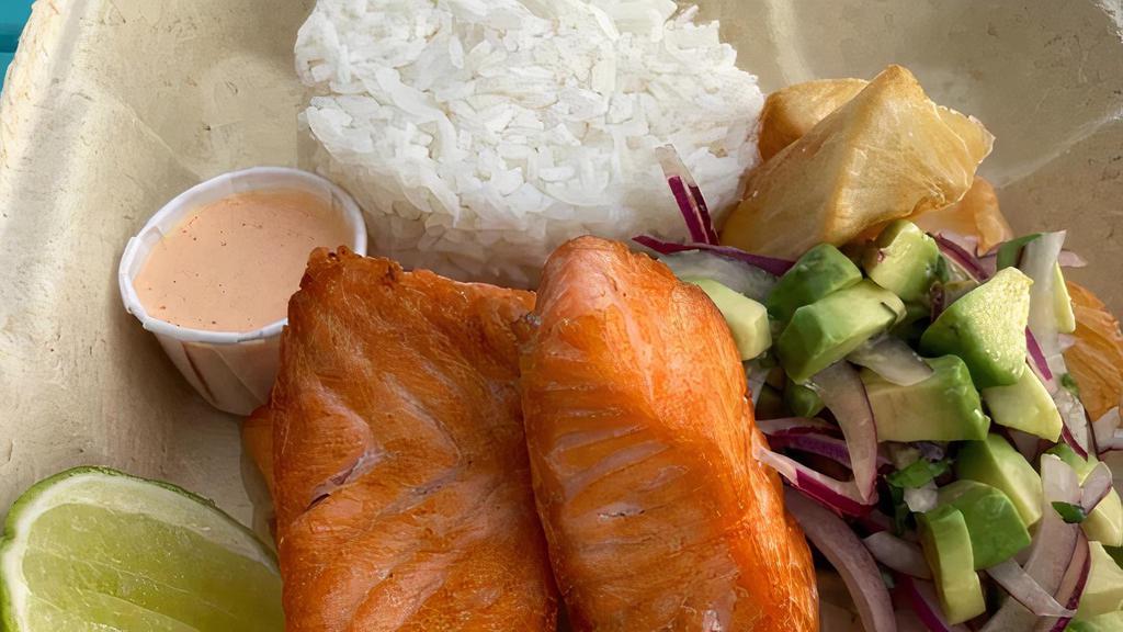 Salmon Special · Pan fried Salmon served with white rice, fried yuca and salsa criolla.