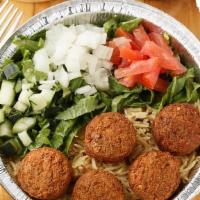 Falafel And Soda Combo Over Rice · Four huge fresh falafel balls with basmati rice and veggies and white sauce and specialty ho...