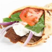 Lamb Gyro Combo With Fries · Lamb gyro with onions and peppers and salad with white sauce and hot sauce served with a fre...