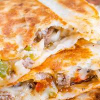 Philly Steak Quesadilla · Grilled tortilla and topped with cheese and philly steak filling! Comes with sour Cream and ...