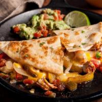 Chicken Fajita Quesadilla · Grilled tortilla and topped with cheese and chicken and papers fajita filling! Comes with so...