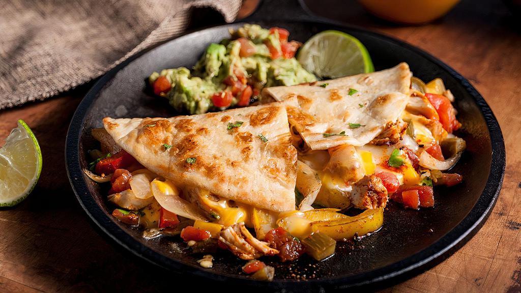 Chicken Fajita Quesadilla · Grilled tortilla and topped with cheese and chicken and papers fajita filling! Comes with sour Cream and chipotle sauce.