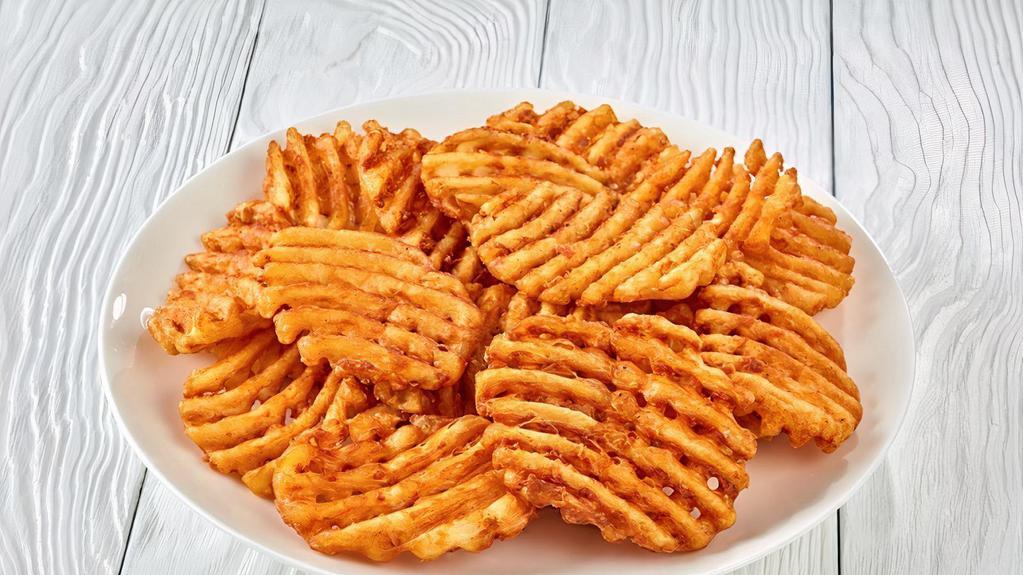 Waffle Fries · Hot and crispy waffle fries with cheese sauce on the side.