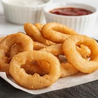 Goldan Onion Rings · Goldan and fresh Onion Rings served with Ranch and cheese sauce.