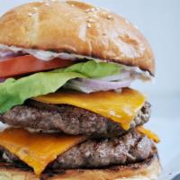 Double Cheeseburger · Freshly ground beef burger doubled made with sesame seeds bun topped any modifiers.