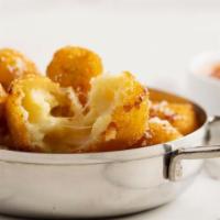 Mac & Cheese Fritters · Served with parmesan tomato sauce.