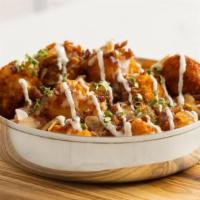 Loaded Tots · Cheddar tots with melted mozzarella, provolone, bacon, caramelized onions, horseradish sour ...