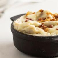 Deluxe Smashed Potatoes · Russet mashed potatoes, country gravy, bacon.