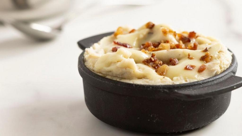 Deluxe Smashed Potatoes · Russet mashed potatoes, country gravy, bacon.