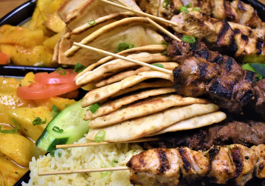 Family Meal 1 (Serves 4) · Choice of 2 dips, choice of a salad, choice of 7 souvlaki sticks, choice of 2 sides, choice of dessert served with tzatziki sauce and pita bread.