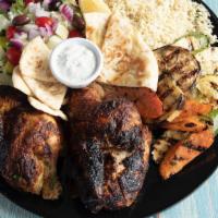 Family Style Chicken · Whole rotisserie chicken. Includes side of rice, grilled vegetables, Greek salad, pita bread...