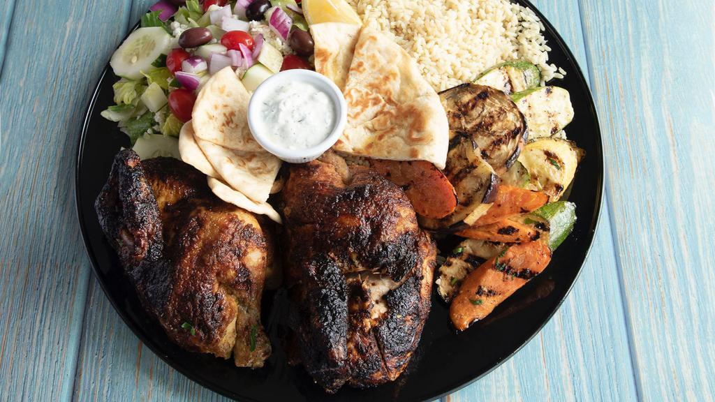 Family Style Chicken · Whole rotisserie chicken. Includes side of rice, grilled vegetables, Greek salad, pita bread and tzatziki sauce.
