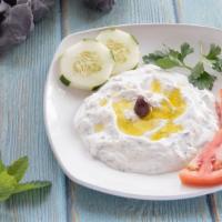 Tzatziki · Greek yogurt, garlic and herbs.