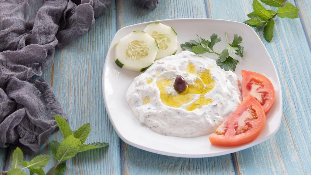 Tzatziki · Greek yogurt, garlic and herbs.