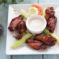 Buffalo Wings · With blue cheese dressing.