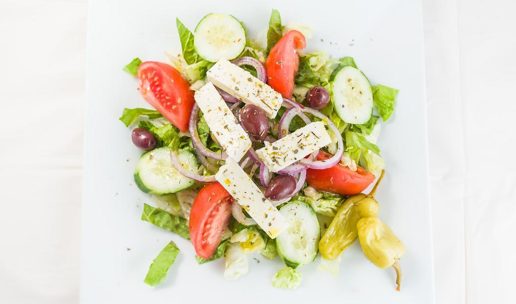 Greek Salad · Romaine and iceberg lettuce, cucumber, tomatoes, onions, olives and crumbled Feta served with vinaigrette dressing.