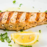 Marinated Grilled Salmon · Char-coal grilled salmon steak.