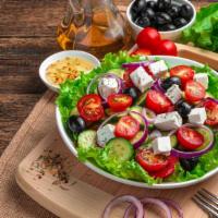 Greek Salad · Fresh romaine lettuce, feta cheese, grape leaves, tomatoes, olives, onions, and balsamic vin...