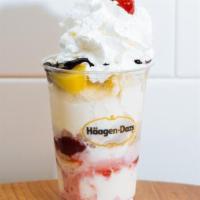 Banana Split Sundae · Two scoops of vanilla, layered with strawberries, pineapple, banana, fudge, topped with whip...