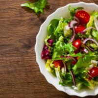Garden Salad · Fresh garden salad prepared with romaine lettuce, carrots, and grape tomatoes. Served with c...