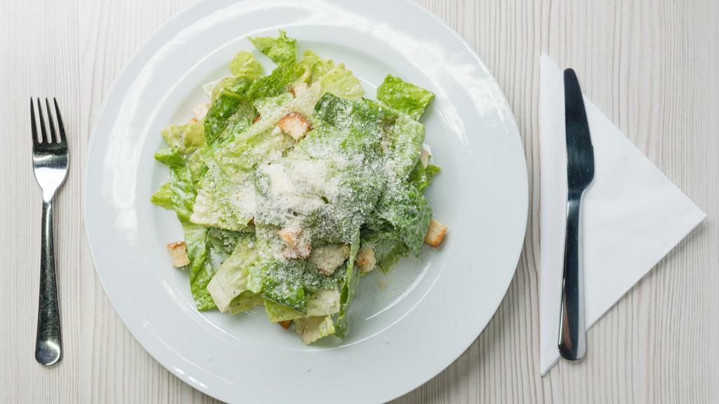 Caesar Salad · Fresh green salad prepared with cheese, romaine lettuce, carrots, grape tomatoes, and caesar dressing.