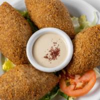 Kibbeh · Four pieces of cracked wheat dough filled with spiced meat, pine nuts and onions.