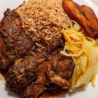Jerk Chicken · Our famous jerk chicken is served with rice and peas or plain rice and cabbage,and sweet pla...