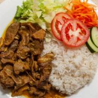 Curry Goat · Our Jamaican curry goat meal is served with white rice or rice and peas ,steam vegetables an...